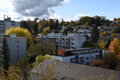 High angle view of trees and buildings against sky