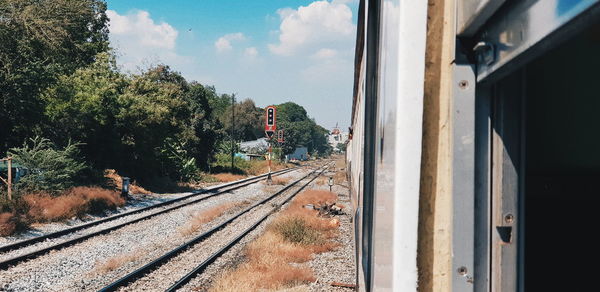 Railroad tracks seen through train window