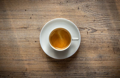 High angle view of coffee cup on table