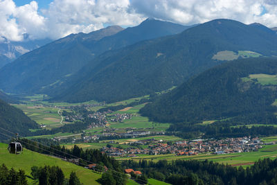 Scenic view of landscape and mountains against sky