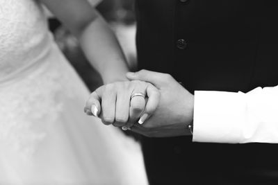 Close-up of couple holding hands