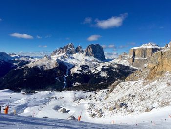 Scenic view of snow covered mountains against sky