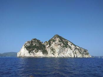 Scenic view of sea against clear blue sky