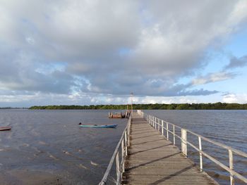 Pier over sea against sky