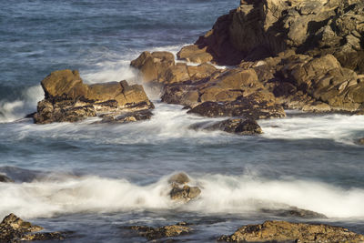 Sea waves splashing on rocks