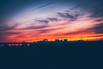 Scenic view of silhouette landscape against sky at sunset