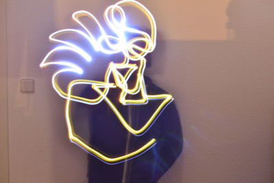 Close-up of illuminated light painting on wall