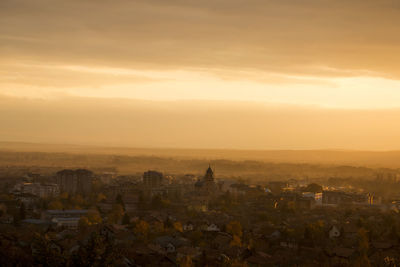 High angle view of cityscape against sky during sunset