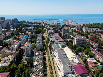 High angle view of city by buildings against sky