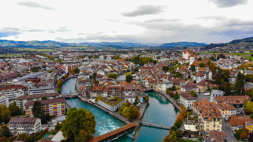 High angle view of river amidst buildings in city