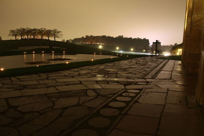 View of illuminated street lights at night