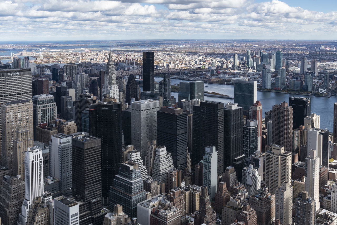 AERIAL VIEW OF MODERN BUILDINGS AGAINST SKY