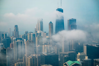 Panoramic view of buildings in city against sky