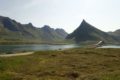 Scenic view of lake and mountains against sky