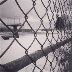 Chainlink fence seen through chainlink fence