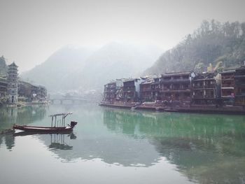 Scenic view of lake in foggy weather