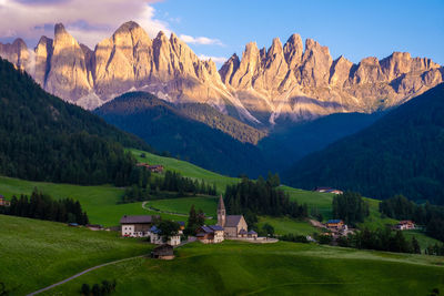 Scenic view of trees and mountains against sky