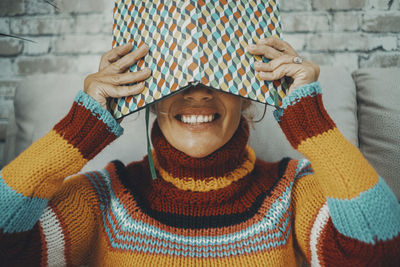 Midsection of woman wearing warm clothing