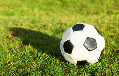 Close-up of soccer ball on field