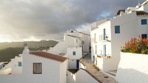 Houses in town against sky