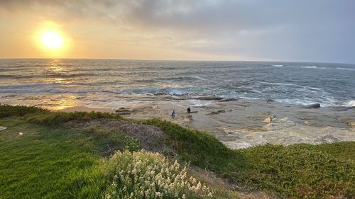 Scenic view of sea against sky during sunset