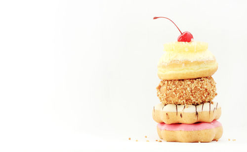 Close-up of cake against white background