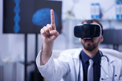 Portrait of young man wearing virtual reality