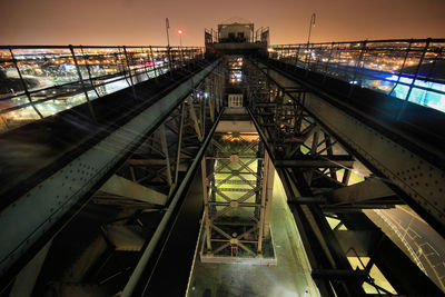 High angle view of illuminated bridge against sky during sunset