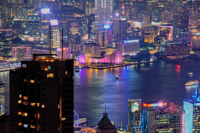 High angle view of illuminated buildings in city at night