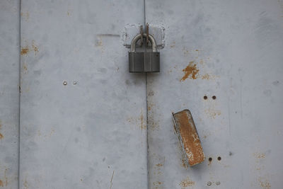 Close-up of padlock on wall