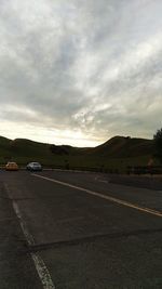 View of road against cloudy sky