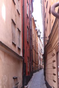 Narrow street amidst buildings in town