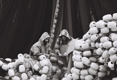 Woman for sale at market stall