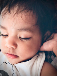 Close-up of cute baby girl sleeping