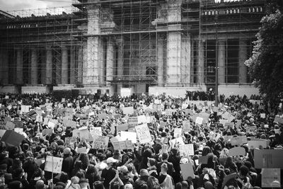 High angle view of people on street amidst buildings in city