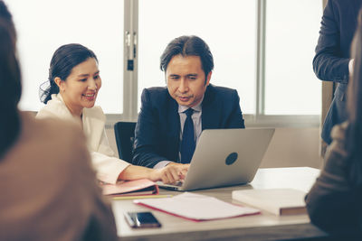 Business colleagues working at office