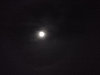 Low angle view of moon against sky at night