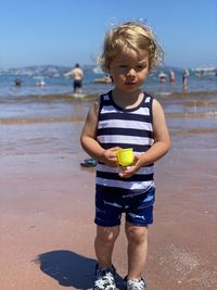 Full length of boy playing at beach