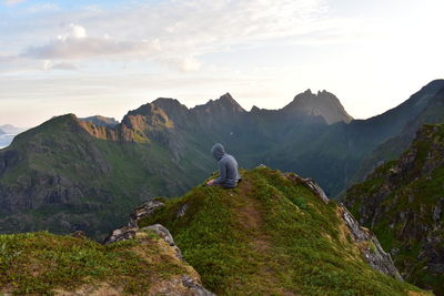 Rear view of man on a cliff 