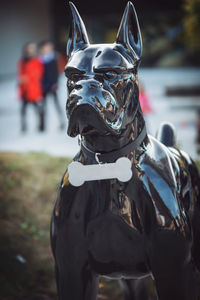 Midsection of person wearing mask outdoors