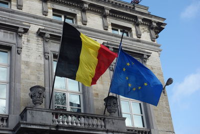 Belgian and european union flags outside the palais de la nation, belgian federal parliament