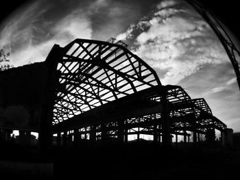 Low angle view of built structure against cloudy sky