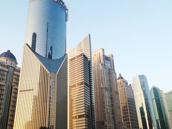 Low angle view of modern buildings against clear sky