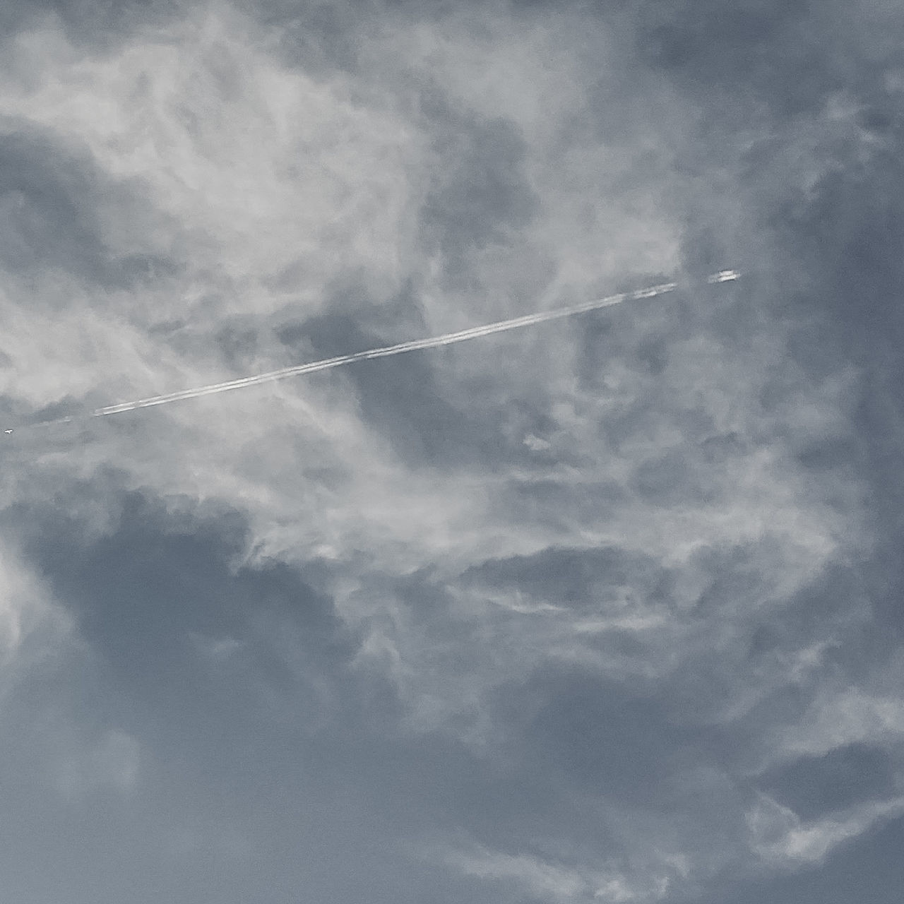 cloud - sky, sky, vapor trail, low angle view, day, nature, beauty in nature, no people, scenics - nature, tranquility, tranquil scene, outdoors, backgrounds, blue, white color, full frame, transportation, smoke - physical structure, on the move