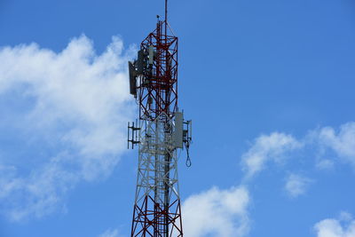 Low angle view of communications tower against sky