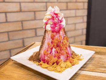 Close-up of pink cake on table