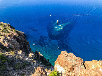 High angle view of rock formation in sea