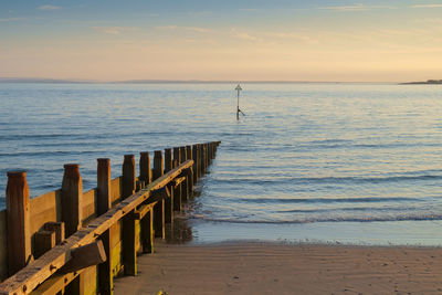 A late evening scene at west wittering, uk,  one of the many groynes protecting this coastline.