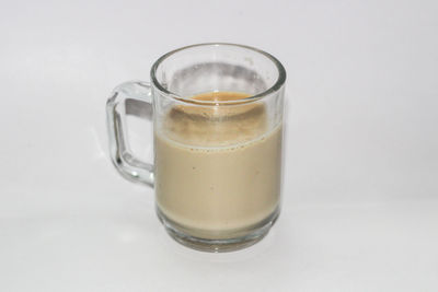 Close-up of drink against white background