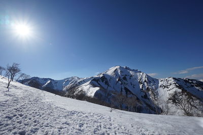 Scenic view of snow mountains against clear sky